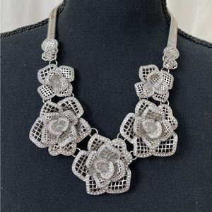 Statement necklace of silver roses with crystals good condition
